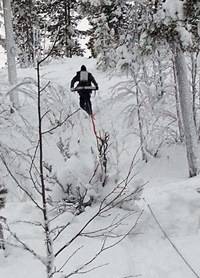 EM-measurements for graphite prospecting in Northern Sweden 2012 Picture with geologist working in snowy landscape